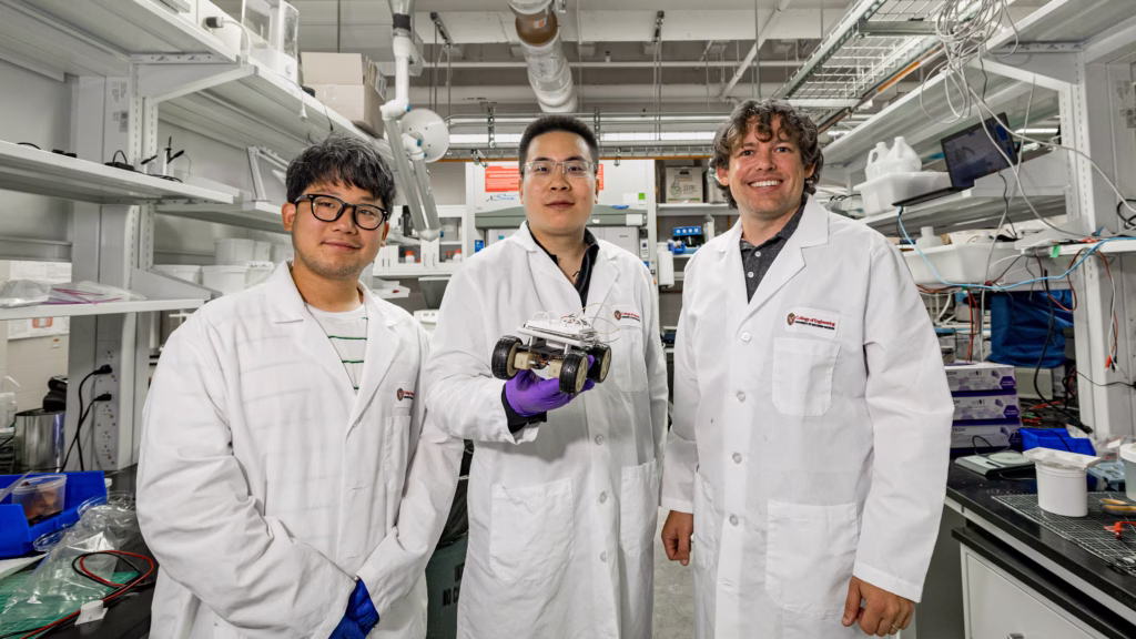 PhD student Euigeol Jung, former postdoctoral fellow Yichao Shi and Professor James Pikul hold a robotic rover that’s powered by their aluminum-air battery