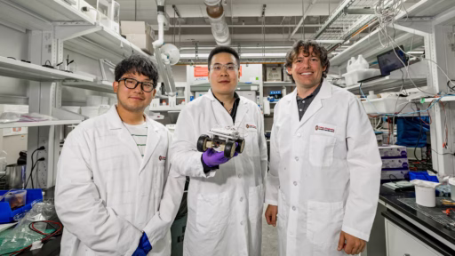 PhD student Euigeol Jung, former postdoctoral fellow Yichao Shi and Professor James Pikul hold a robotic rover that’s powered by their aluminum-air battery