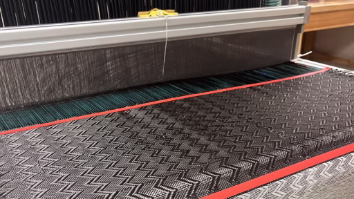 Associate Professor Pavana Prabhakar’s lab group used a loom to weave a metal “yarn” into a carbon fiber fabric