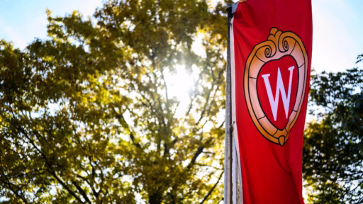 A W crest banner flutters in the wind on Bascom Hill at the University of Wisconsin-Madison during autumn on Oct. 18, 2019