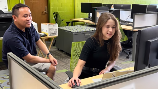 Gwenyth Severson (right) discusses the research project on computer architecture she undertook in the lab of Associate Professor Joshua San Miguel as part of the ECE SPARK program in summer 2026