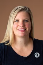 Profile photo of Susann Daniel. She has blonde hair and is wearing a black shirt.
